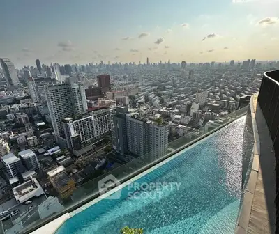 Stunning rooftop pool with breathtaking city skyline view, perfect for luxury urban living.