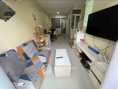 Cozy living room with modern decor and entertainment setup, ideal for relaxation and gatherings.
