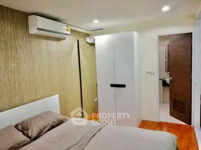 Modern bedroom with air conditioning and stylish decor