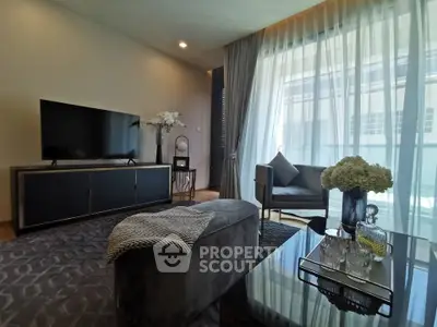 Elegant living room with modern decor, large window, and stylish furniture in a luxurious apartment.