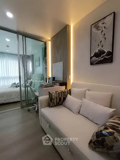 Modern living room with stylish decor and cozy seating in a contemporary apartment.