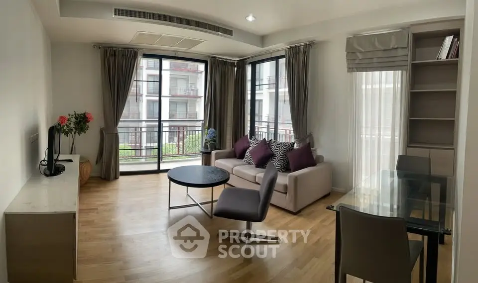 Spacious modern living room with large windows and stylish furniture