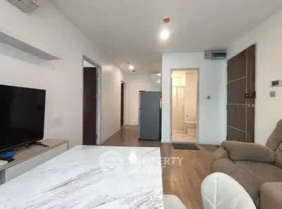 Modern living room with open layout and stylish furniture in a contemporary apartment.