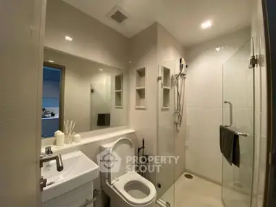 Modern bathroom with glass shower and sleek fixtures