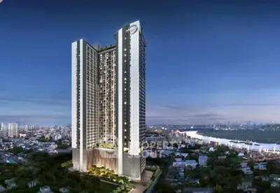 Stunning high-rise building with panoramic city and river views at dusk.