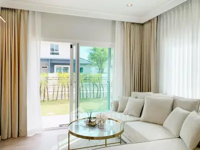 Bright and airy living room with elegant decor and garden view