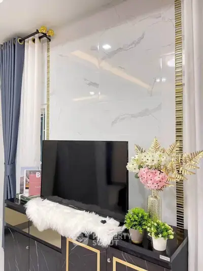 Elegant living room with modern TV setup and stylish decor