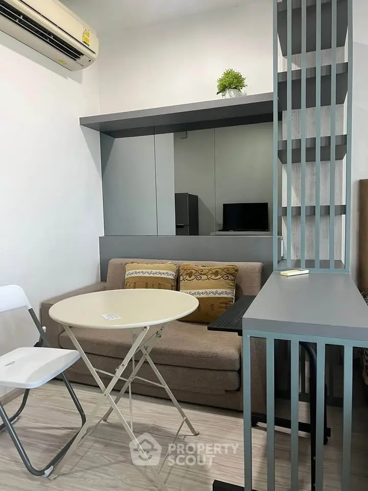 Cozy living room with modern decor and air conditioning