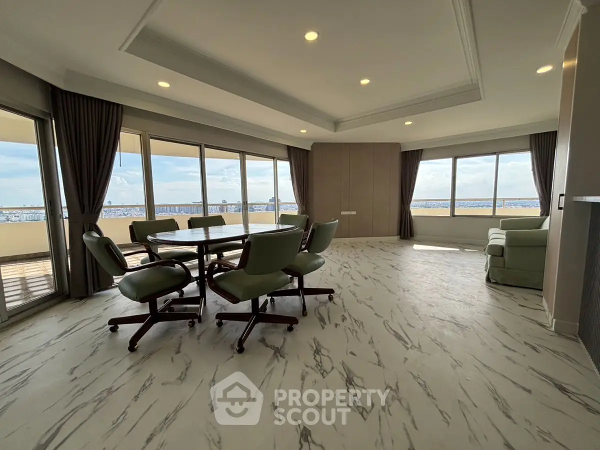 Spacious living room with panoramic windows and elegant marble flooring