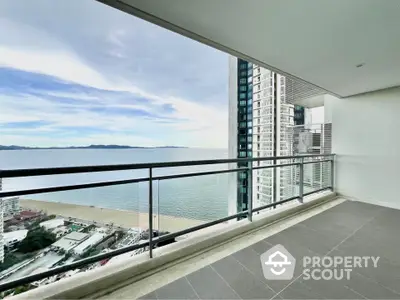 Stunning ocean view from spacious balcony in modern high-rise apartment