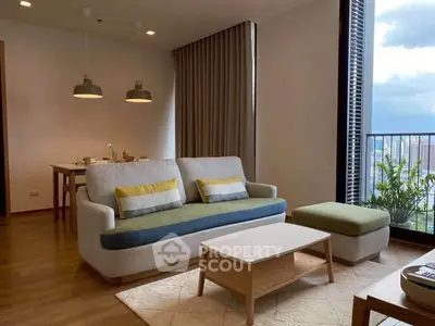 Modern living room with stylish furniture and city view balcony