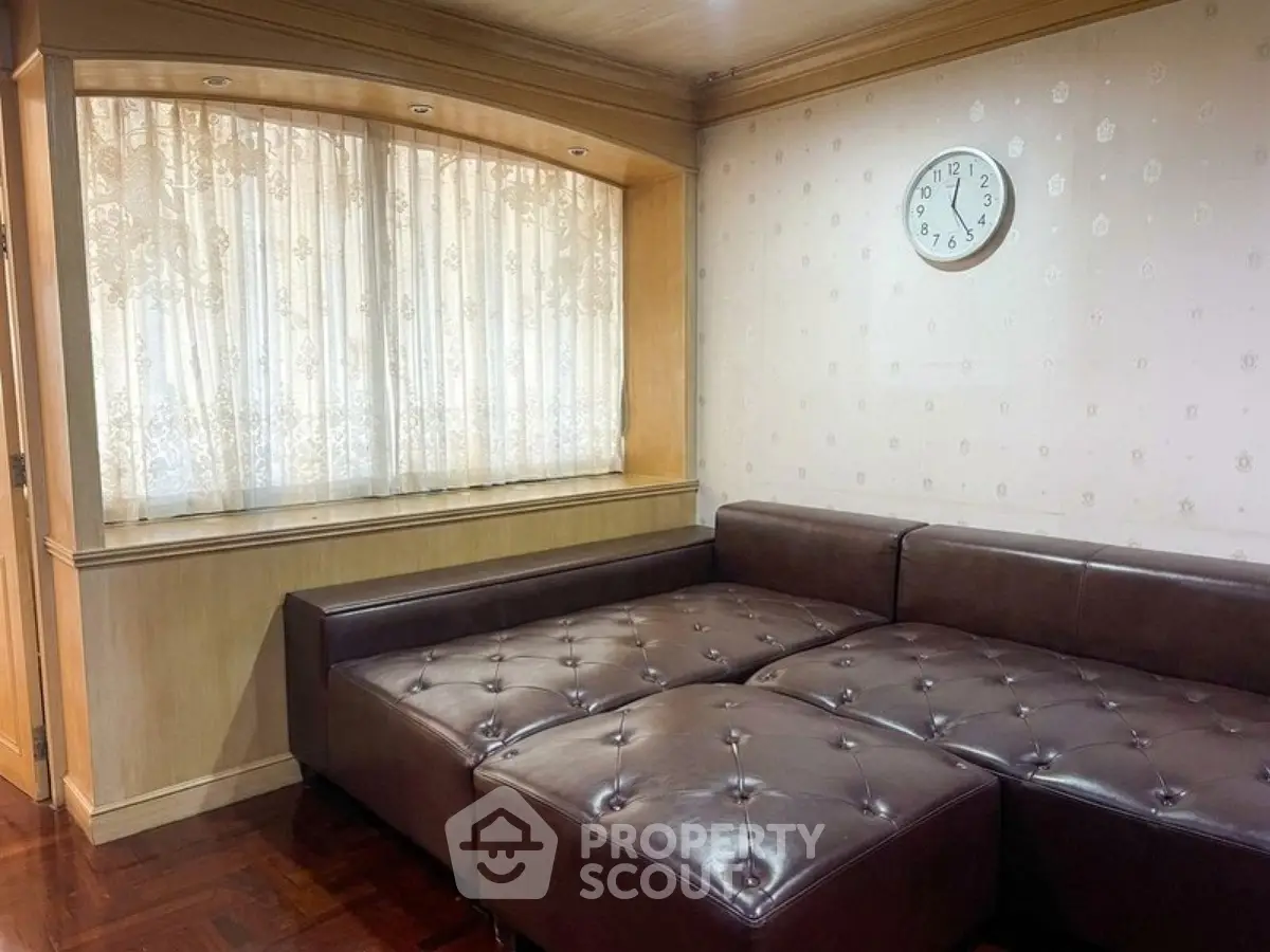 Cozy living room with leather sectional sofa and elegant decor