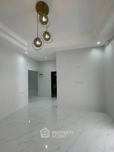 Modern minimalist interior with elegant lighting and marble flooring