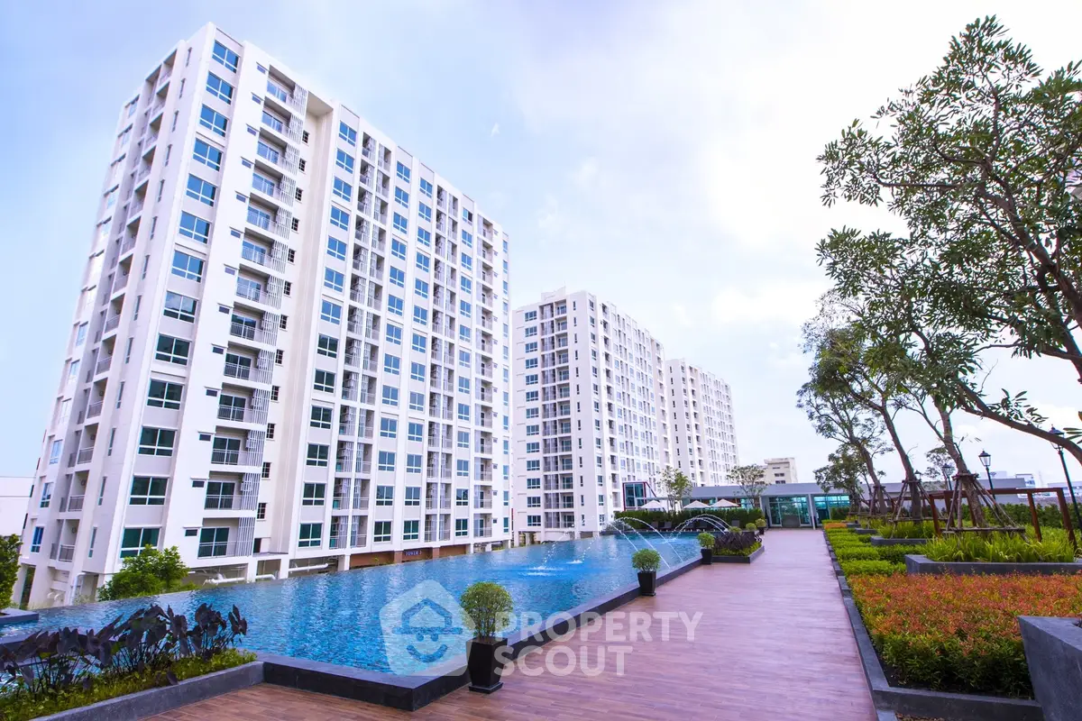 Luxurious apartment complex with stunning pool and landscaped gardens