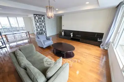 Spacious living room with modern decor and hardwood floors