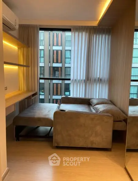 Modern living room with cozy sofa and large window view