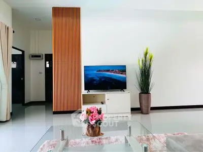 Modern living room with sleek TV setup and stylish decor