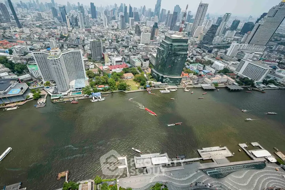 Stunning aerial view of a bustling cityscape with riverfront buildings and vibrant skyline.