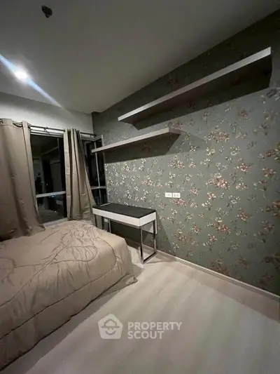 Cozy bedroom with floral wallpaper and modern shelving, perfect for a stylish retreat.