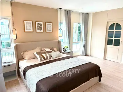 Spacious and elegant bedroom with modern decor and natural light
