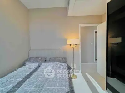 Modern bedroom with stylish decor and natural light