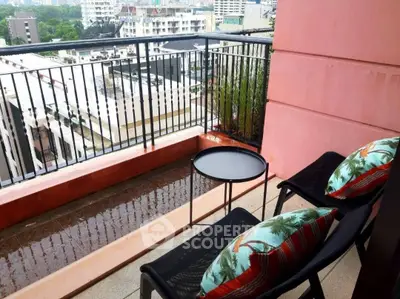 Charming balcony with city view, perfect for relaxation and enjoying the urban landscape.