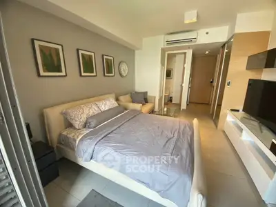 Modern bedroom with stylish decor and natural light in a contemporary apartment.