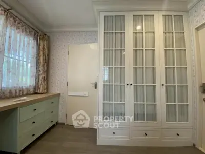 Charming bedroom with elegant built-in wardrobe and natural light