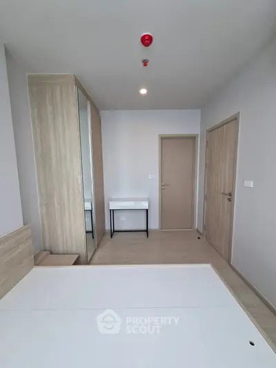 Modern minimalist bedroom with built-in wardrobe and sleek design