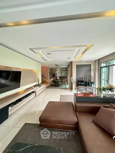 Luxurious modern living room with sleek design and open layout, perfect for entertaining.