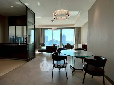 Luxurious modern living room with stunning city view and elegant chandelier