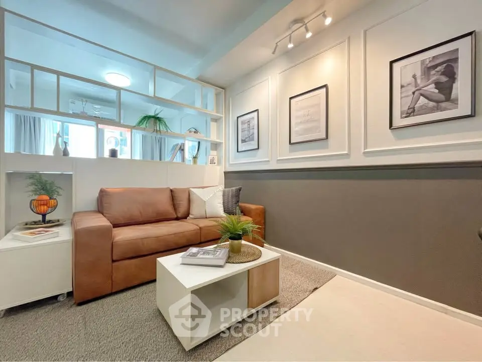 Stylish living room with modern decor and cozy seating in a contemporary apartment.