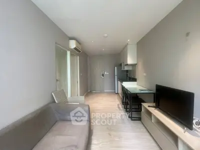 Modern living room with sleek furniture and open kitchen layout