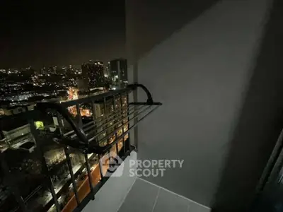 Stunning city view from a high-rise balcony at night, perfect for urban living enthusiasts.