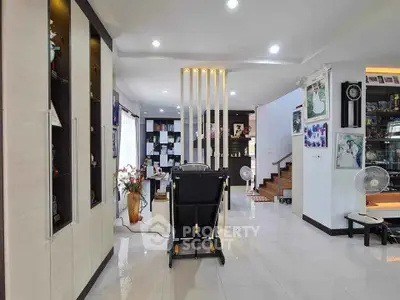 Spacious modern living area with sleek design and ample natural light