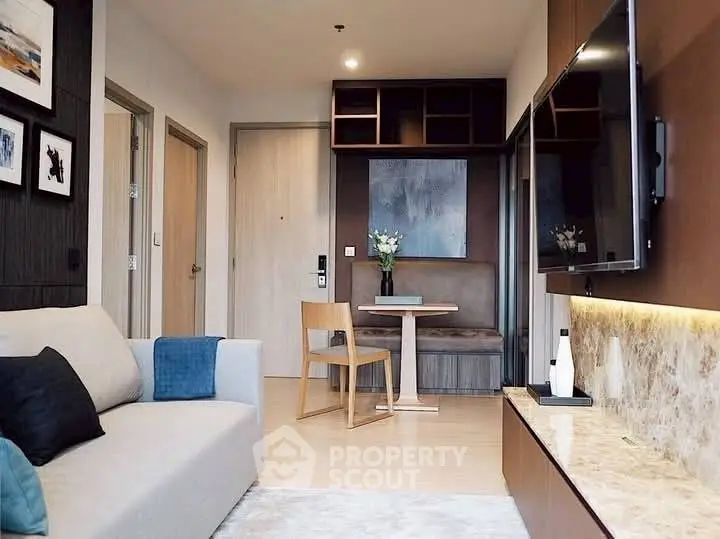 Modern living room with stylish decor and open layout, featuring a cozy seating area and elegant furnishings.