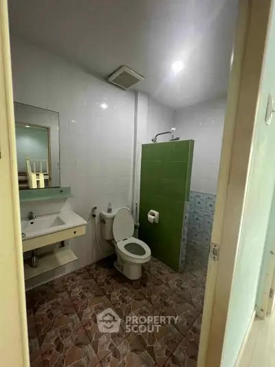 Spacious bathroom with modern fixtures and stylish tile flooring