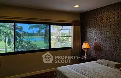 Luxurious bedroom with stunning golf course view and elegant decor