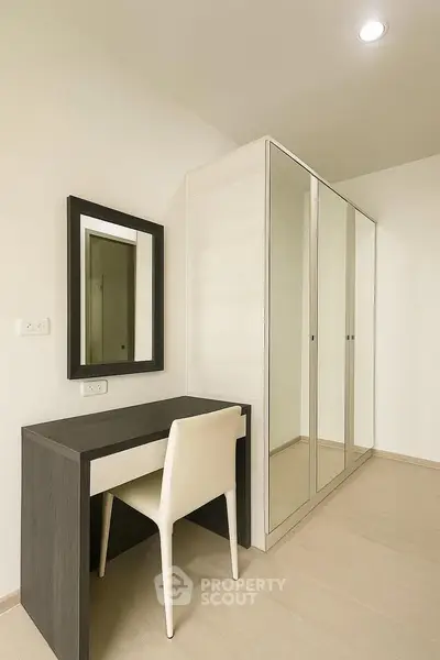 Modern study nook with sleek desk and mirror in minimalist design