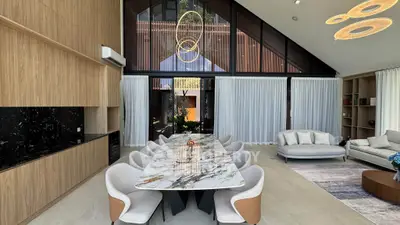 Luxurious modern living room with elegant marble dining table and stylish lighting fixtures.