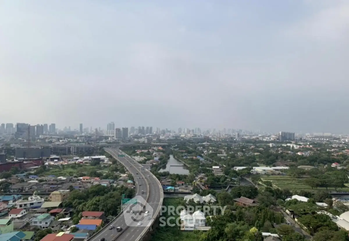 Stunning cityscape view showcasing urban skyline and highway, ideal for real estate investment opportunities.