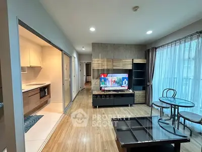 Modern living room with open kitchen and stylish decor