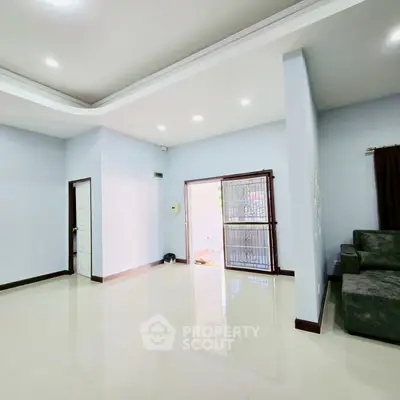 Spacious living room with modern design and ample natural light