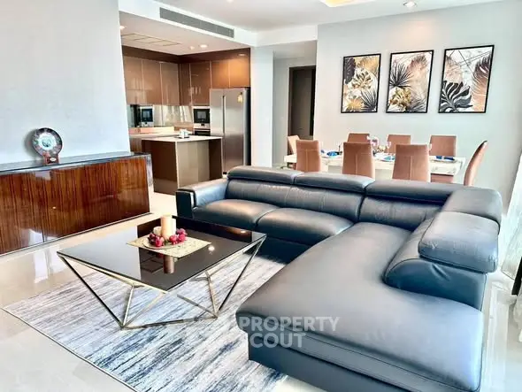 Luxurious open-plan living room with modern kitchen and elegant dining area.