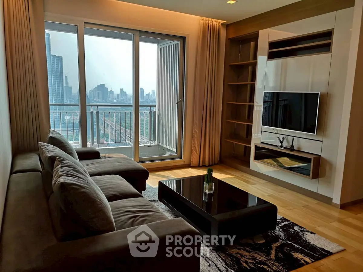 Modern living room with city view, stylish furniture, and floor-to-ceiling windows in a high-rise apartment.