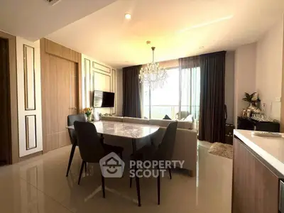 Elegant dining area with chandelier and modern decor in a spacious living room