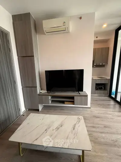 Modern living room with sleek furniture and air conditioning, perfect for comfortable living.