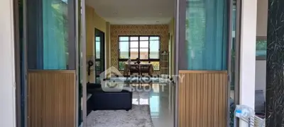 Spacious living room with modern decor and large windows offering natural light.