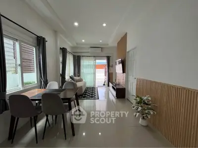 Modern living room with elegant dining area and stylish decor