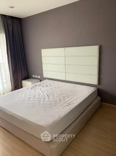 Spacious modern bedroom with elegant design and natural light